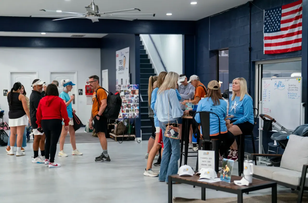 Group of players mingling at an indoor Pickleland social event