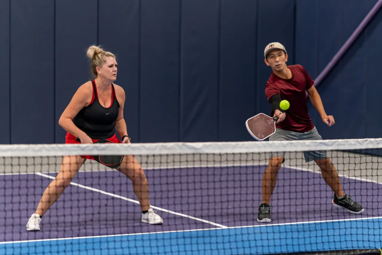 Pickleball play at the net
