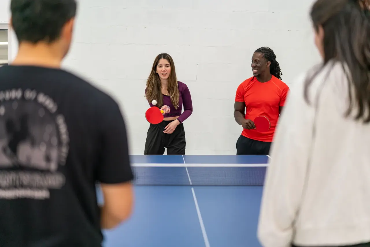 Guests playing ping pong at a Pickleland event