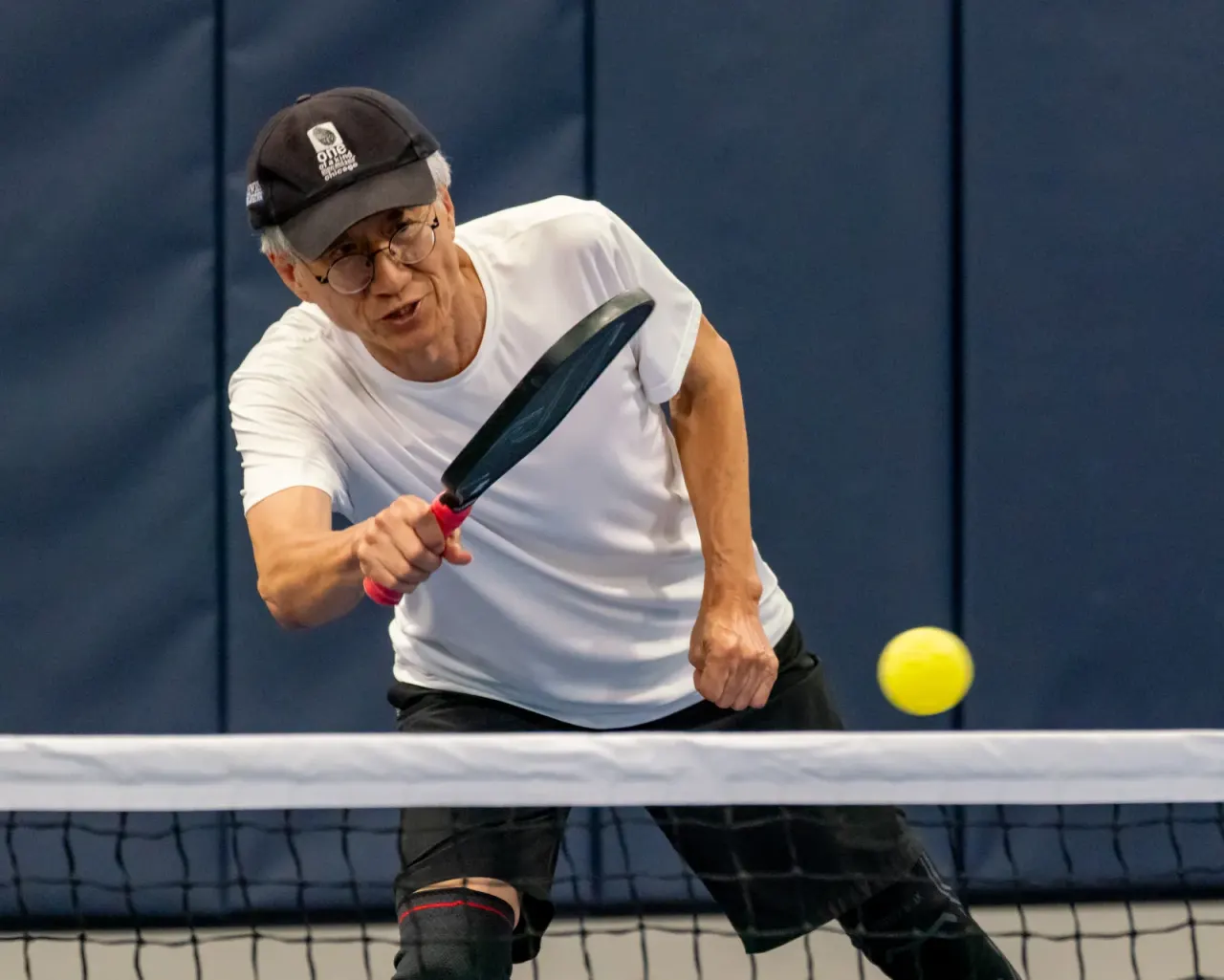 Player retreating to play a deep ball at Pickleland