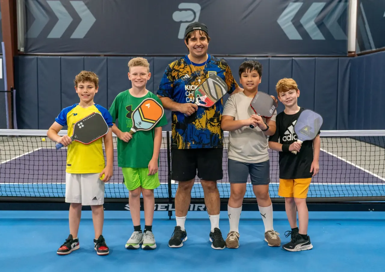 Young players with a coach during homeschool open play