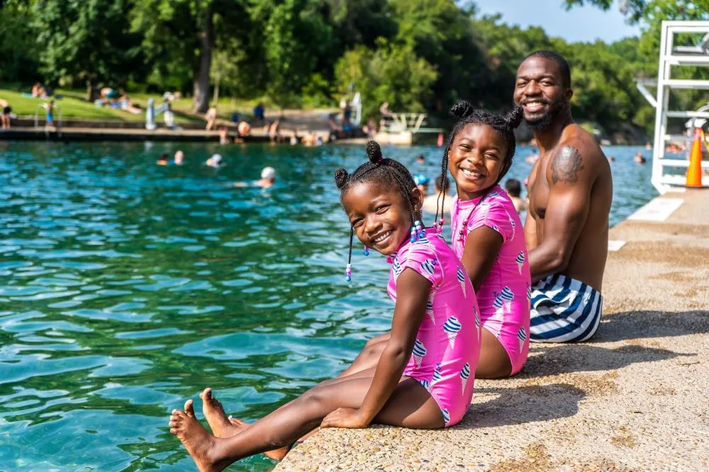 Swimmers in the clear spring-fed water of Barton Springs Pool
