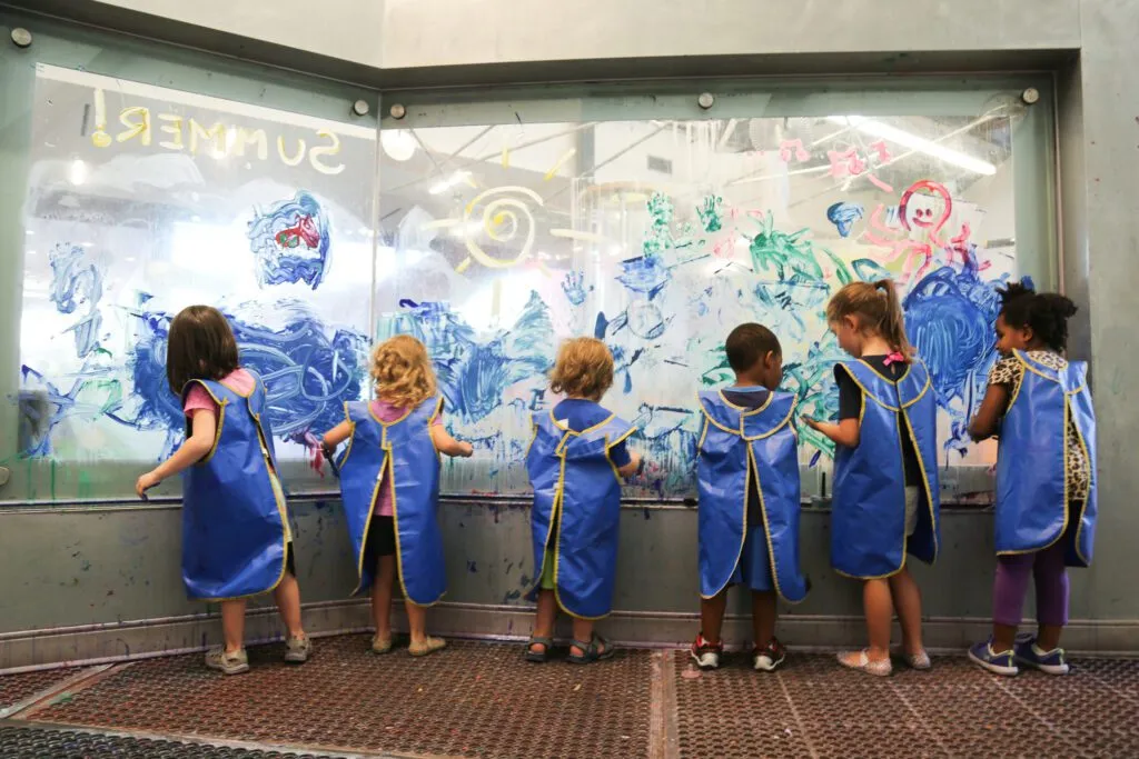 Kids exploring hands-on STEAM exhibits at the Thinkery children's museum