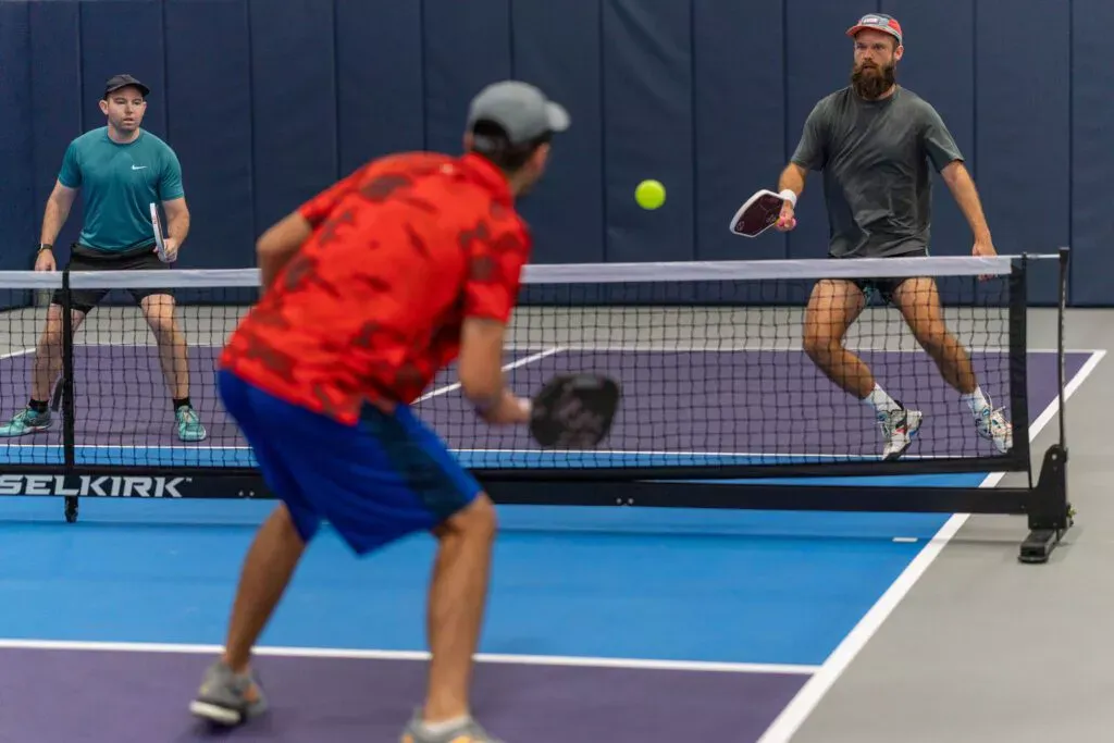 Players competing in a corporate pickleball tournament on the courts at Pickleland